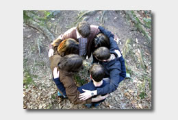 group of people in huddle