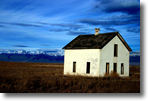 Small 
white house near mountains